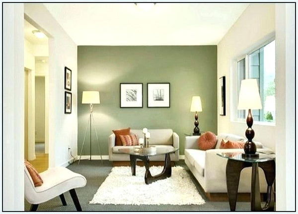 modern furnished living room with green wall in background